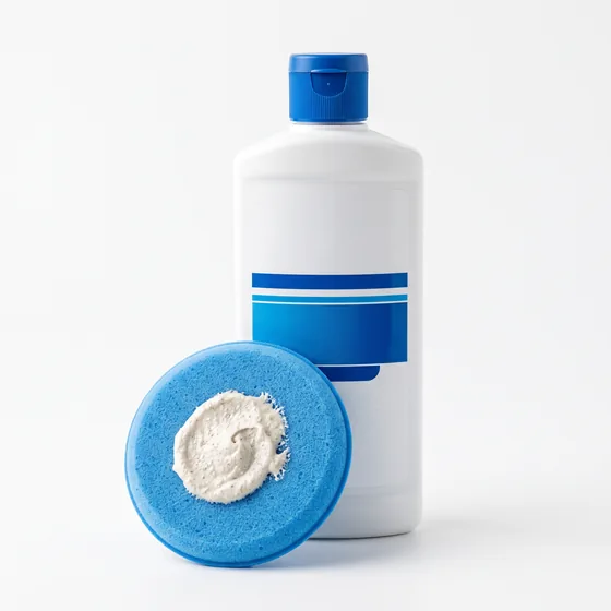 Bottle of rubbing compound with foam pad